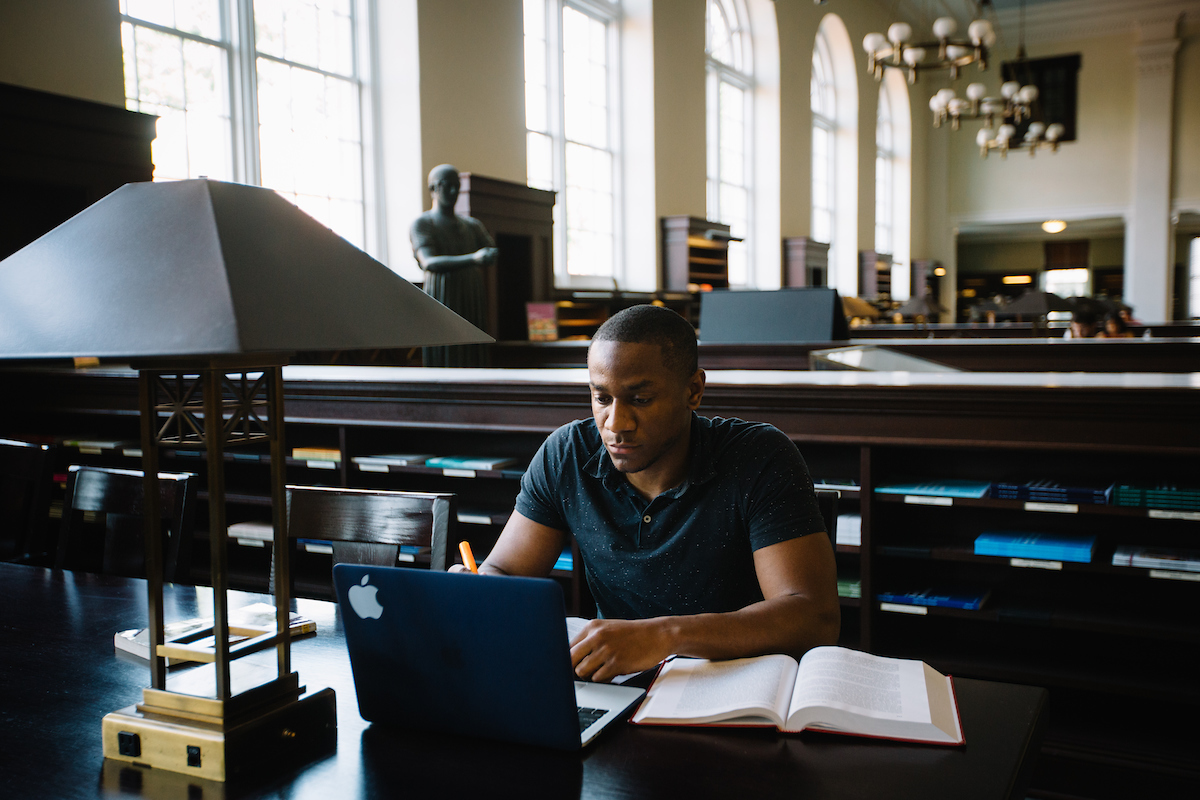 student studying in Candler Library